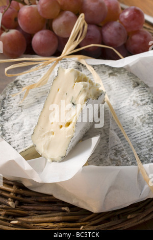 Blue cheese (Bresse Bleu, France) and grapes - Stock Photo