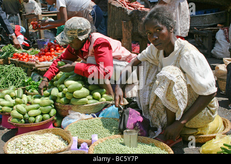 Selling Fruit and Vegetables on Her Market Stall In Antananarivo, Madagascar Stock Photo