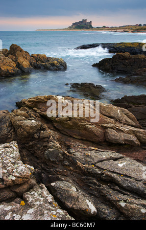 A view of Bamburgh Castle from Harkess Rocks on the Northumberland Coast Stock Photo