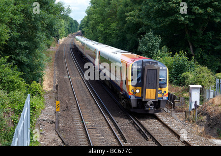 SWT (South West Trains) Class 444 electric unit near Winchester o the south-wester main line. Note third rail electric suppy. Stock Photo