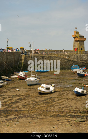 Boats On The Mud In Lynmouth harbour at Low Tide North Devon England Stock Photo