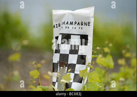 Air Champagne aerial crop spraying sign on vines at Bouzy Montagne de Reims France Stock Photo