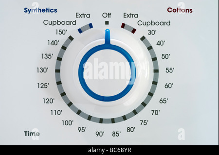 Temperature control dial and timer dial on a White Tumble Dryer Stock Photo