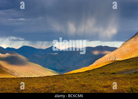 Passing rain squall over the Ogilvie Mountains Tombstone Territorial Park Yukon Canada Stock Photo