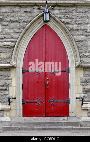 Red Door of Christ Church in Montreal city, Quebec Canada Stock Photo