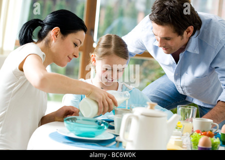 Family eating breakfast together Stock Photo