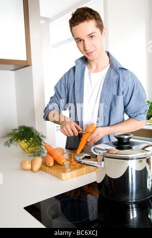 man peeling carrots Stock Photo