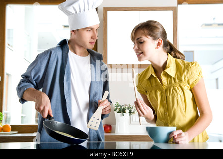 couple cooking together Stock Photo