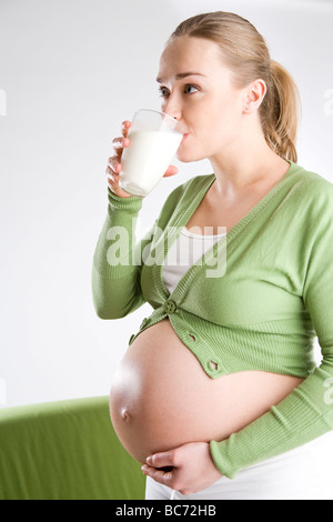 pregnant woman drinking milk Stock Photo