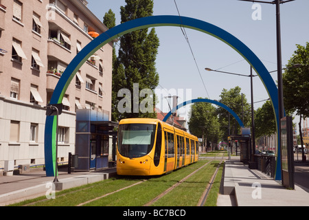 Mulhouse Alsace France Yellow city tram train in local station with overhead electrification on new light rail tramway network Stock Photo