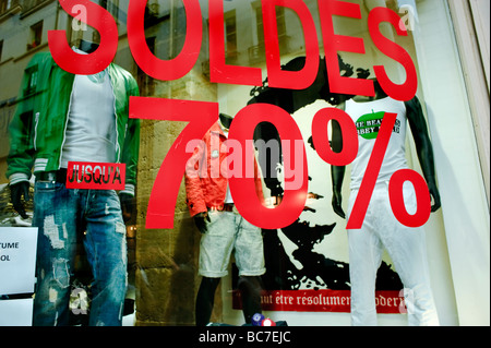 Paris France, Clothes Shopping, Trendy Men's Shop, in the Le Marais, Summer sales labels on clothes Shop Window, fast fashion, blue jeans Stock Photo