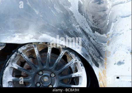 Rust on bodywork of stolen and burnt out car Stock Photo