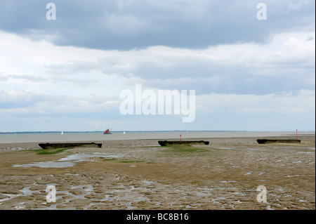 Sunken barges on mudflats,Dengie Peninsula,Essex coast Stock Photo
