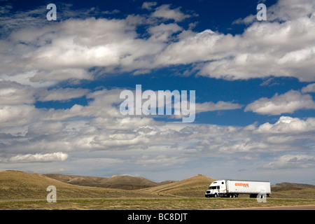 Long haul truck traveling on Interstate 80 in Carbon County Wyoming USA  Stock Photo