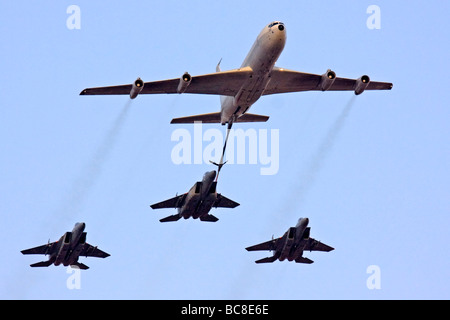 3 Israeli Air force F15 Fighter jets being refueled by a Boeing 707 in flight Stock Photo