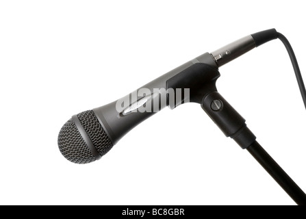 Vocal / karaoke microphone in holder / stand on a white background Stock Photo