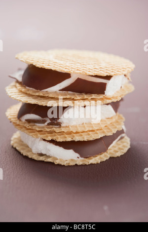 Chocolate-coated marshmallows sandwiched between wafers - Stock Photo