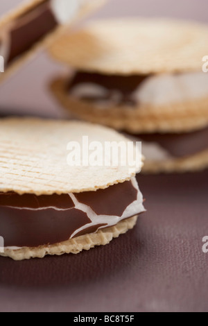 Chocolate-coated marshmallows sandwiched between wafers - Stock Photo