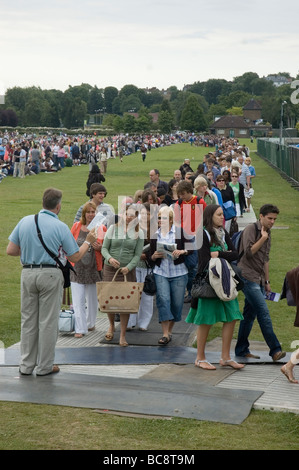 People queuing for the Wimbledon Tennis Championships in Wimbledon Park