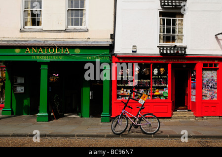 Street scene in Bridge Street Cambridge with Anatolia Turkish restaurant and Joke shop, Cambridge England Uk Stock Photo