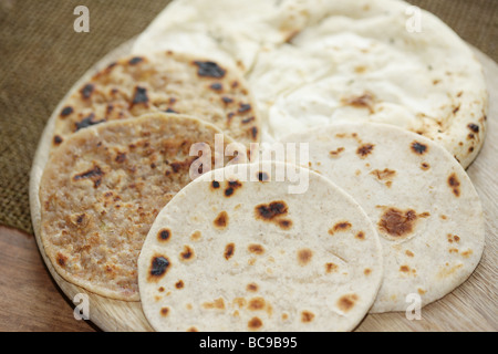 Selection of Middle Eastern And Indian Flatbreads Including Pitta Paratha Naan And Chapati Bread Stock Photo