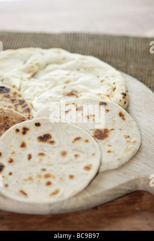 Selection of Middle Eastern And Indian Flatbreads Including Pitta Paratha Naan And Chapati Bread Stock Photo