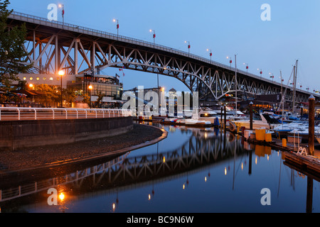 Promande and small Marina at False Creek at twilight Granville Bridge Vancouver Canada North America Stock Photo