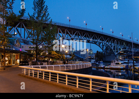 Promande and small Marina at False Creek at twilight Granville Bridge Vancouver Canada North America Stock Photo