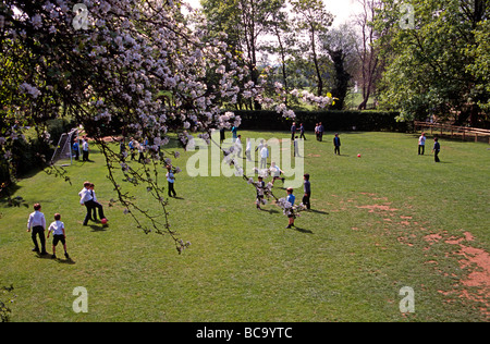 Children on playing field of Magdalen College private School Oxford England UK Stock Photo