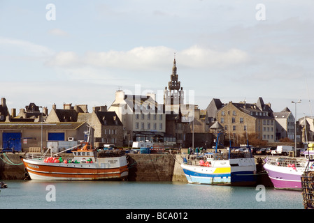 Colourful fishing boats and bell tower of the Notre Dame de Croas Batz church, Roscoff, Brittany, France Stock Photo