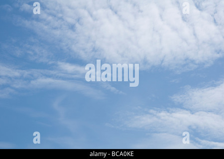 Soft thin fluffy clouds developing into a blanket. Stock Photo