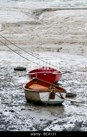 Two dinghies on the mud at low tide in Leigh on Sea in Essex.  Photo by Gordon Scammell Stock Photo