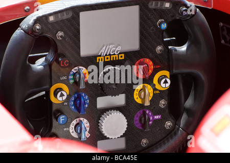 steering wheel of formula one red ferrari racing car Stock Photo
