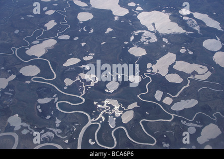 Aerial View of the North Siberian Tundra with lakes and meandering rivers in Spring, Siberia, Russia Stock Photo