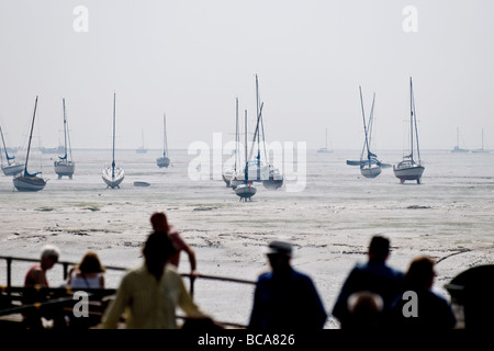 Boats and people at low tide in Leigh on Sea in Essex.  Photo by Gordon Scammell Stock Photo