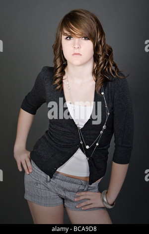 Shot of a Cute Teenager against Grey Background Stock Photo
