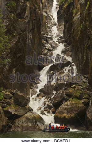 Explor Waterfall Tourists in an inflatable explore waterfall Stock Photo - Alamy