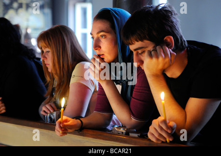 Young people attending Easter mass at the Greek Orthodox Patriarchate Church the Hagios Georgios built in 1720. Stock Photo