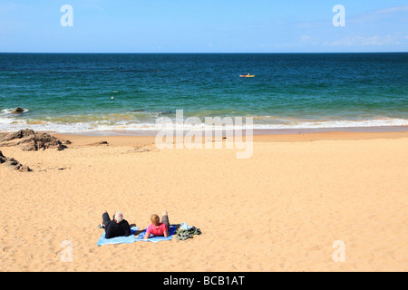 People sunbathing on Greve de Lecq beach Jersey Channel Island, United Kingdom Stock Photo
