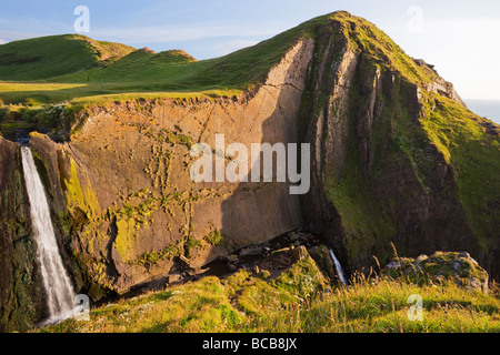 Speke's Mill Mouth waterfall on North Devon Heritage Coast summer sun England UK United Kingdom GB Great Britain British Isles Stock Photo