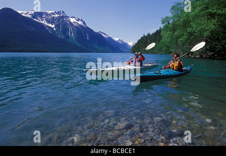 Kayaking on Chilkoot Lake and the Takshanuk Mountains. Stock Photo