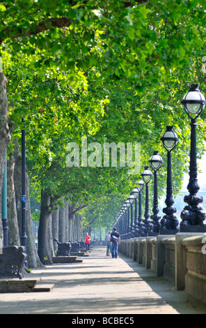 Young couple strolling along Chelsea Embankment London SW3 United Kingdom Stock Photo