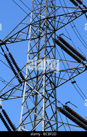 Electricity Grid Pylons against a blue sky part of our National Grid and environmental landscape Stock Photo