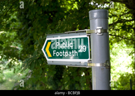 Public Footpath sign with the green trees in the background Stock Photo