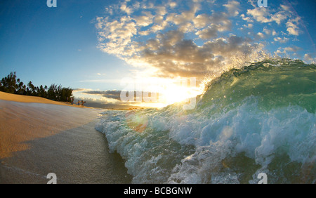 Wave crashing on beach Stock Photo