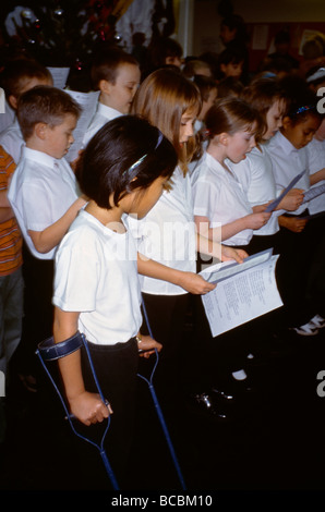 Multi Ethnic group Of Children Singing In Choir At Christmas Stock Photo