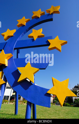Big logo of European € (euro) currency on blue sky Stock Photo