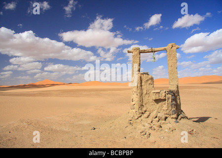 Water well by Erg Chebbi sand dunes in the Sahara Desert, near Merzouga, southern Morocco, North African Stock Photo