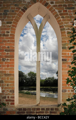 Arched window view onto a lake. Stock Photo