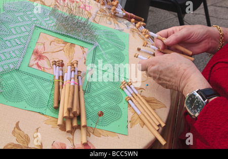 Lace making Bobbins thread and frame Stock Photo